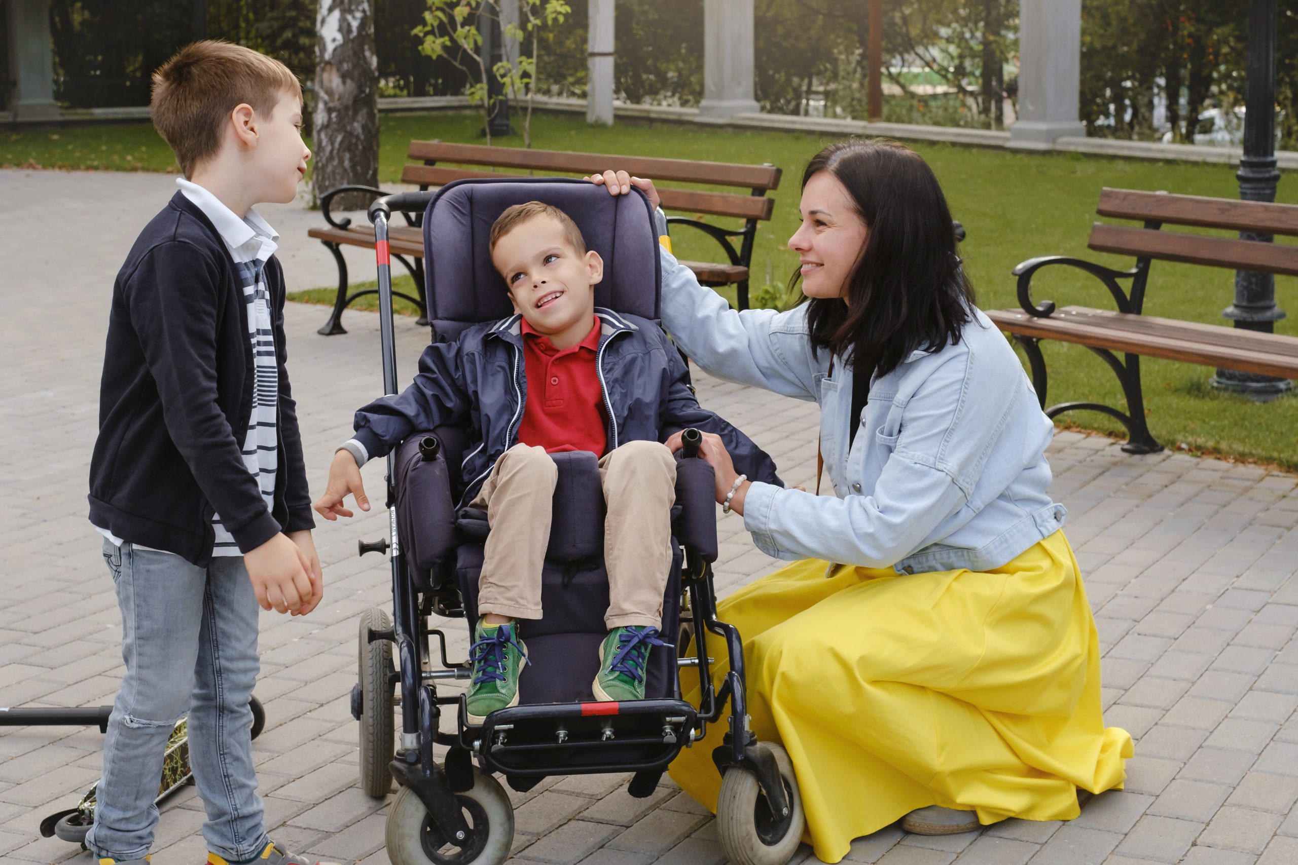 Wheelchair user navigating a wide, step-free corridor in a fully accessible SDA home